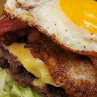 The Breakfast Burger · Double cheese burger, yellow American cheese, crispy hashbrown, crispy bacon, fried egg, and...