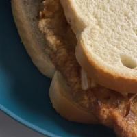 Pork Chop Sandwich · Golden Fried Pork Chop and Bread with chips plain, hot or bbq