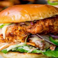Crispy Chicken Burger · Served with mayo, lettuce onion, cheese, and tomato.