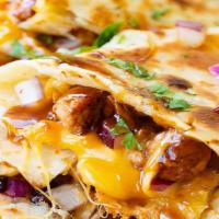 Quesadilla · Serve with Meat Cheese Lettuce, Tomato And Sour Cream Your choice is steak, chicken, gyro, g...