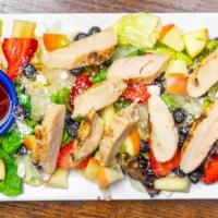 Berry Chicken Salad · Crisp salad greens tossed with strips of grilled chicken breast, fresh strawberries, blueber...
