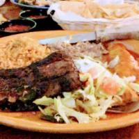 Carne A La Tampiquena Steak · Skirt steak carefully spiced and grilled to perfection. Complimented with one enchilada with...