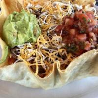 Taco Salad · Rice, beans, lettuce, tomato, cheese, onion, guacamole, sour cream, olives and salsa, served...