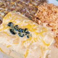 Beef · Served with Spanish rice & refried beans on the side. Two rolled corn tortillas filled with ...