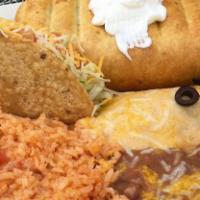 One Chicken Enchilada, One Hard Shell Chicken Taco And A Chicken Chimichanga · Topped with sour cream, served with beans rice and beans on the side.