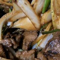 Mongolian Beef · Hot and spicy. Tender beef with scallions, onions, and garlic in hoisin sauce.