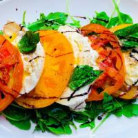 Caprese Salad · Arugula, tomatoes, fresh mozzarella, basil, aged balsamic