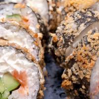 Rocky Mountain Roll · White tuna, crab, avocado wrapped in seaweed & rice, with whole tempura fried served w. eel ...