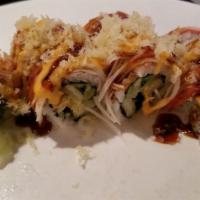 Spicy Santa Roll · Shrimp tempura, cucumber inside, topped w. crunchy crab meat, scallion, masago served w. che...