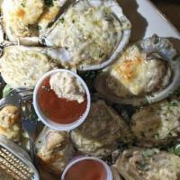 Chargrilled Oysters 1 Doz · One dozen sizzling, char-grilled oysters saturated in an herb butter sauce, topped with a sp...