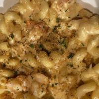 Seafood Mac & Cheese · Succulent lobster, shrimp, crawfish, white cheddar, Parmesan cheese.