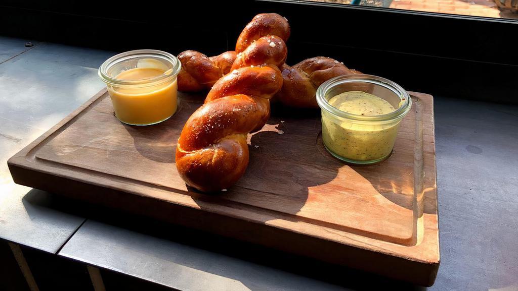 Twisted Pretzels · Vegetarian. Hand-rolled, sea salt, cheddar fondue, beer mustard.