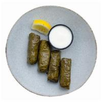 Stuffed Grape Leaves · House-rolled vine leaves stuffed with lamb and rice (soy-free, halal), or vegetarian style w...