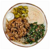 Chicken Shawarma Entrée · Marinated chicken breast with brown rice, hommus, tabbouleh, garlic sauce, and pickles. (glu...