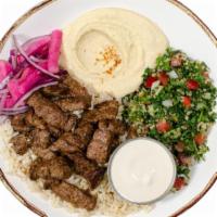 Beef Shawarma Entrée · Marinated beef with brown rice, hommus, tabbouleh, red onions, pickled turnips, and tahini s...