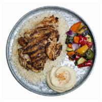Deboned Chicken Entrée · Marinated boneless half chicken, served with brown rice, grilled vegetables, and hommus - it...