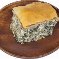 Spinach Pie (Piece) · A blend of feta, cottage cheese, spinach, fresh dill and onions between layers of filo dough...