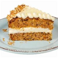 Carrot Cake · Delicate cake combining carrots, pineapple & spices, topped with cream cheese frosting, toas...