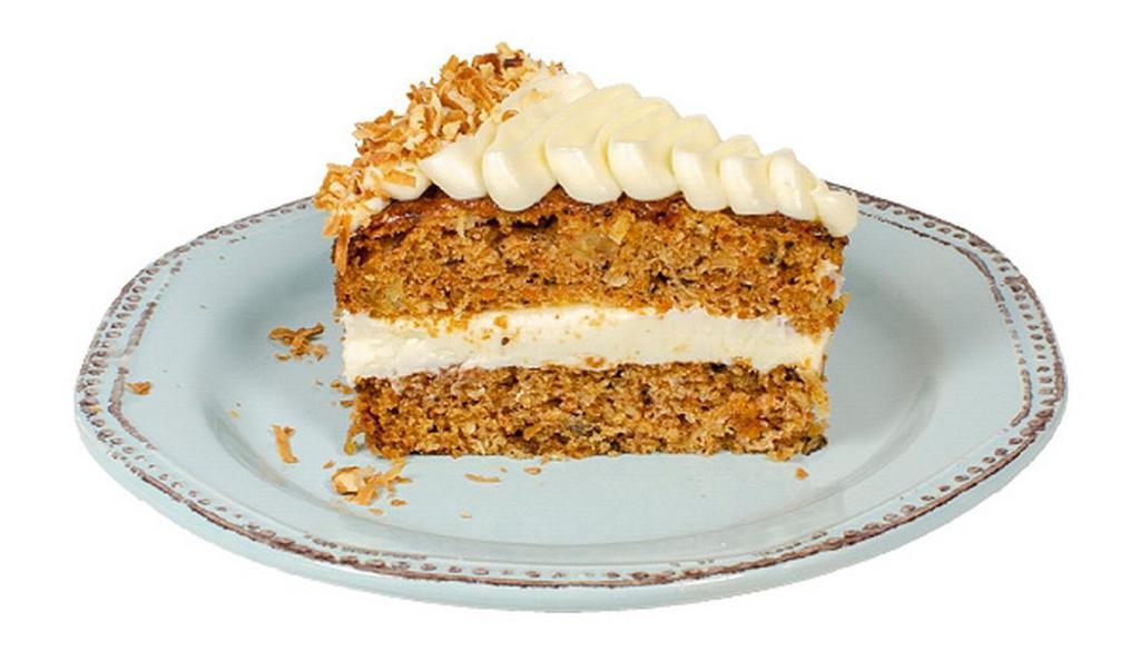 Carrot Cake · Delicate cake combining carrots, pineapple & spices, topped with cream cheese frosting, toasted coconut & walnuts. (gluten-free)