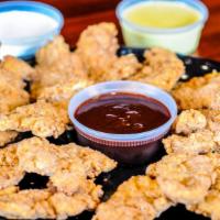 Buttermilk Chicken Tenders · 24 chicken tenders served with ranch, BBQ sauce and honey mustard