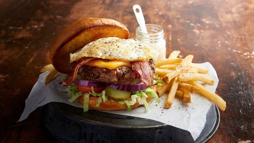 Farmhouse Burger · Applewood bacon, cheddar-jack cheese, an over-medium fried egg, lettuce, tomato, red onion and pickles