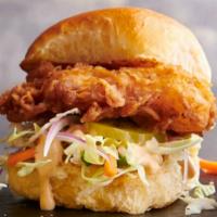 Crispy Chicken Sliders · Three crispy, fried chicken sliders topped with coleslaw, red onion, pickles and sriracha ai...