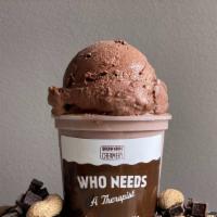 Who Needs A Therapist Ice Cream · Dark chocolate ice cream with a peanut butter ribbon.