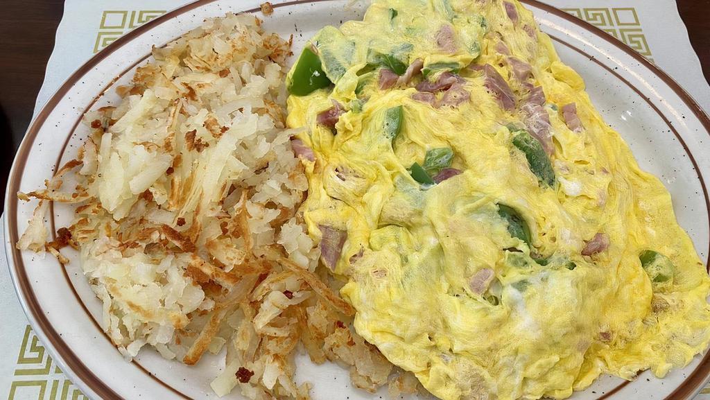 Western Omelette · Ham, green peppers, onion and cheese. Made with three eggs and served with hash browns or pancakes and toast and jelly.