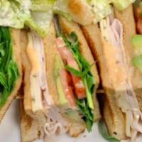 Turkey Club Sandwich · Mixed greens, cucumber, tomato, avocado, pepper jack cheese, and sriracha aioli.