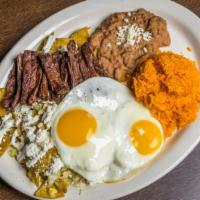 Chilaquiles With Eggs & Meat · Served with rice and beans.