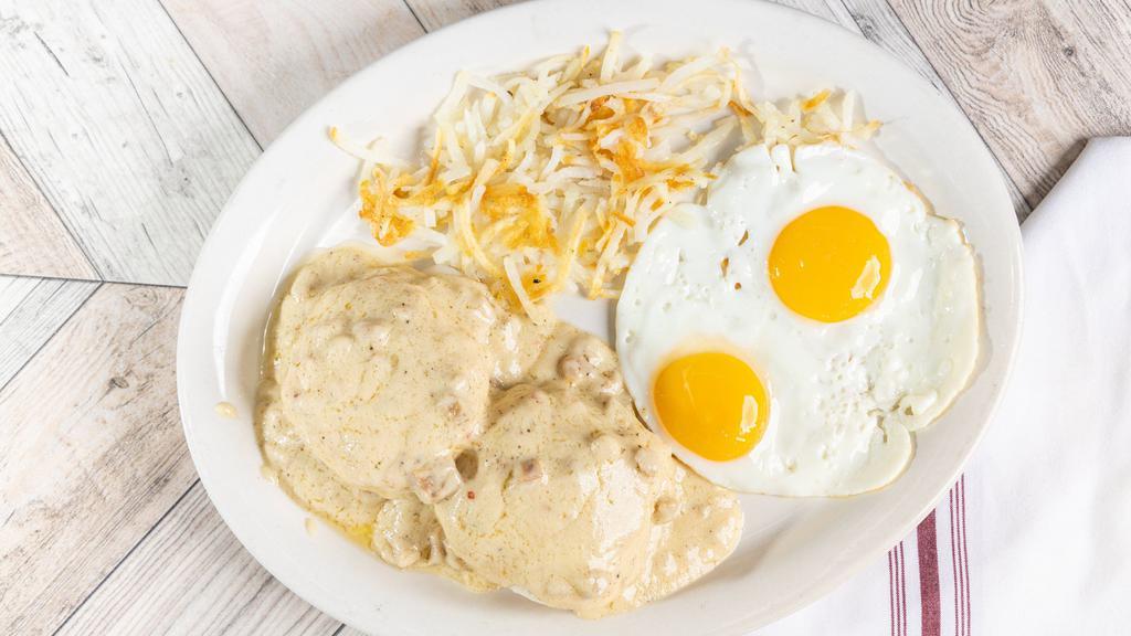 Biscuits & Gravy · Two flaky biscuits topped with savory sausage gravy and served with two eggs any style, hash browns, and your choice of pancakes or toast.