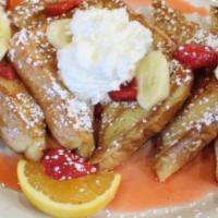 Banana Split French Toast · Our original French toast topped with fresh bananas, strawberries, and whipped cream.
