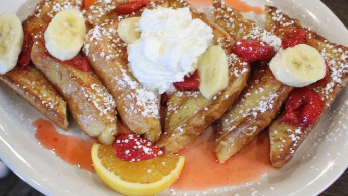 Banana Split French Toast · Our original French toast topped with fresh bananas, strawberries, and whipped cream.