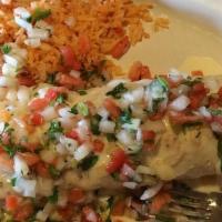 Burrito Loco · Stuffed with chicken, steak, grilled onions, beans and lettuce. Includes sour cream, rice, g...