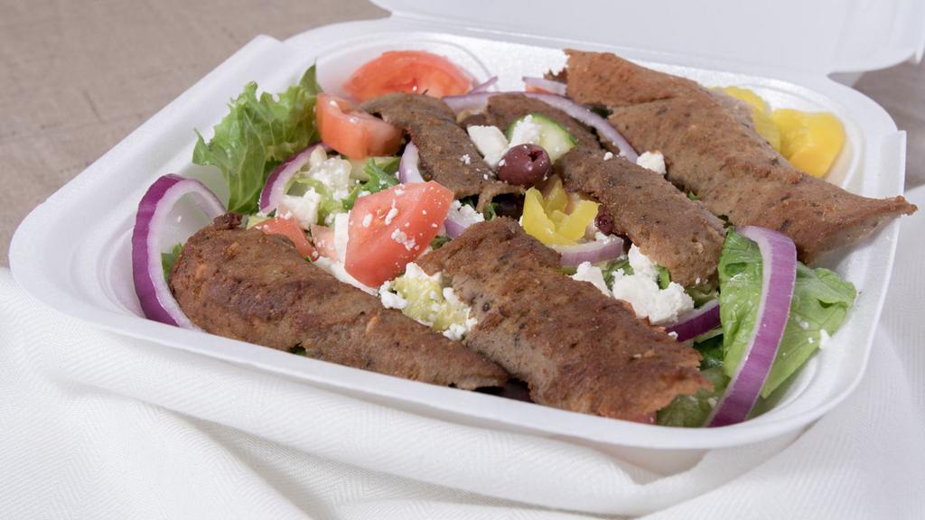 Gyro Salad · Gyro meat, lettuce, tomatoes, sliced cucumbers, onion, olives, crumbled feta cheese & your choice of gyro sauce or housemade tangy gyro sauce.