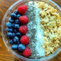 Sunshine Bowl · Blended with mango, raspberry, almond butter, topped with granola, blueberry, raspberry, chi...