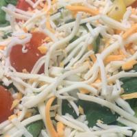 House Salad · Romaine and spinach mix topped with, cucumbers, onions, tomatoes, and cheese.