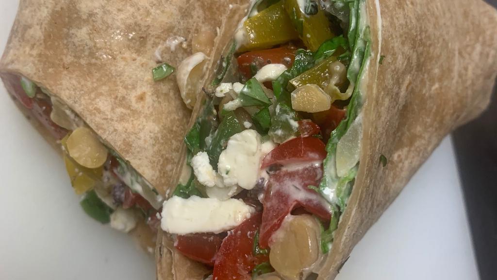 Mediterranean Veggie Wrap · Go meatless for lunch with this flavorful, fiber-filled Mediterranean veggie wrap! It's filled with vegetables over protein-rich hummus wrapped in a wheat tortilla.