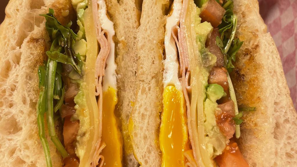 The West Coast · Sliced turkey, fontina cheese, arugula, tomato, avocado and balsamic glaze on a ciabatta