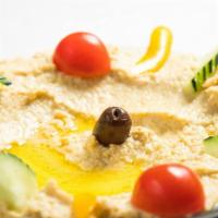 Hummus (Authentic) · Pureed chick pea dip with tahini, extra virgin olive oil and lemon. *Garnished with onions, ...
