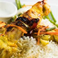 Chicken Kabob · Two skewers of skinless chicken breast marinated and grilled. Served with your choice of sid...