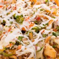 Meat Nachos · (With Sour Cream and Guacamole) Includes chips, beans, cheese, lettuce, and tomato. Choice o...