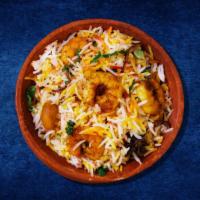 Shrimp Deluxe Biryani · Shrimps cooked in a special biryani masala curry, layered with imported long grain rice and ...
