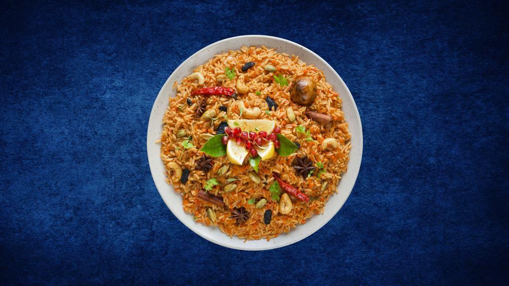 Vegetable Deluxe Biryani · Seasonal veggies cooked in a special biryani masala curry, layered with imported long grain rice and steamed till cooked and smoked with coal