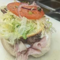 Mini Rustic  · Turkey, Ham and roast Beef with Smoked Gouda cheese, Then topped with Lettuce, Tomato and On...