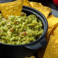 Chips & Guacamole · Delicious, corn tortilla chips served with a homemade guacamole.