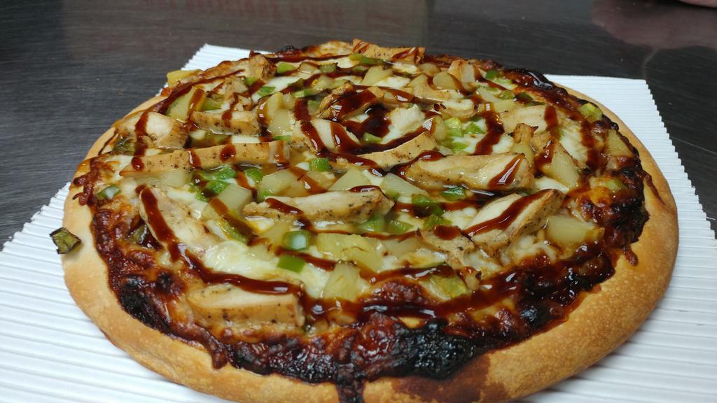 Teriyaki Chicken Pizza · Teriyaki sauce topped with chicken, pineapple, green peppers, and cheese.
