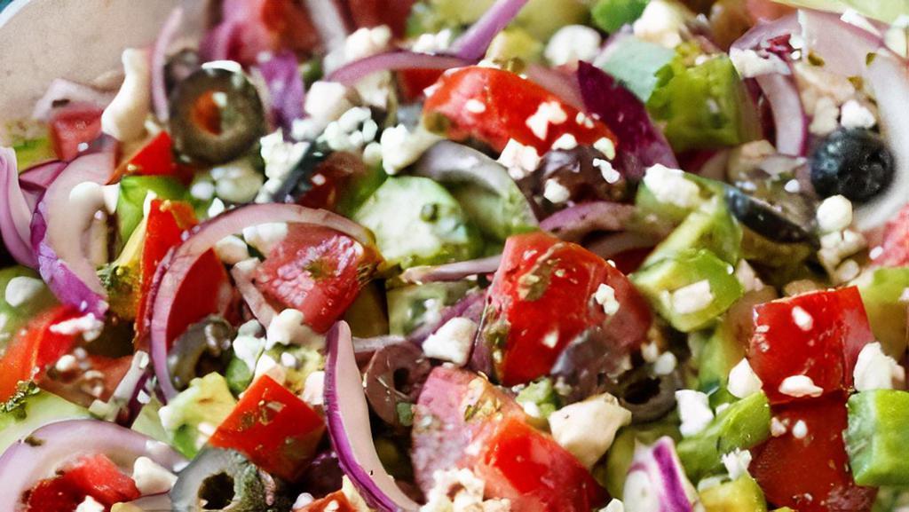 Greek Salad · Crisp, lettuce mix generously topped with feta cheese, tomato black olive, green peppers, banana peppers, & dressing.