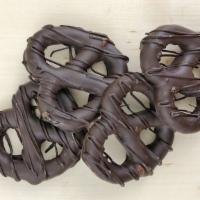 Pretzels - Dark · Four pretzels enrobed in 52% cacao dark chocolate, drizzled with dark chocolate and packaged...