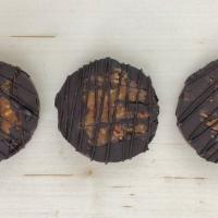 Turtles - Dark · Three 1.5oz turtles. Caramel and pecan pieces are mixed together then dipped and drizzled wi...